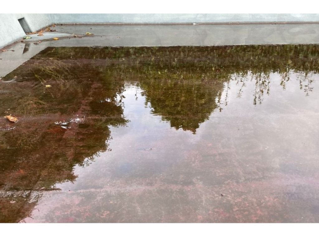 Fibreglass flat roof water pooling